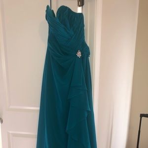 Floor length green bridesmaid dress.